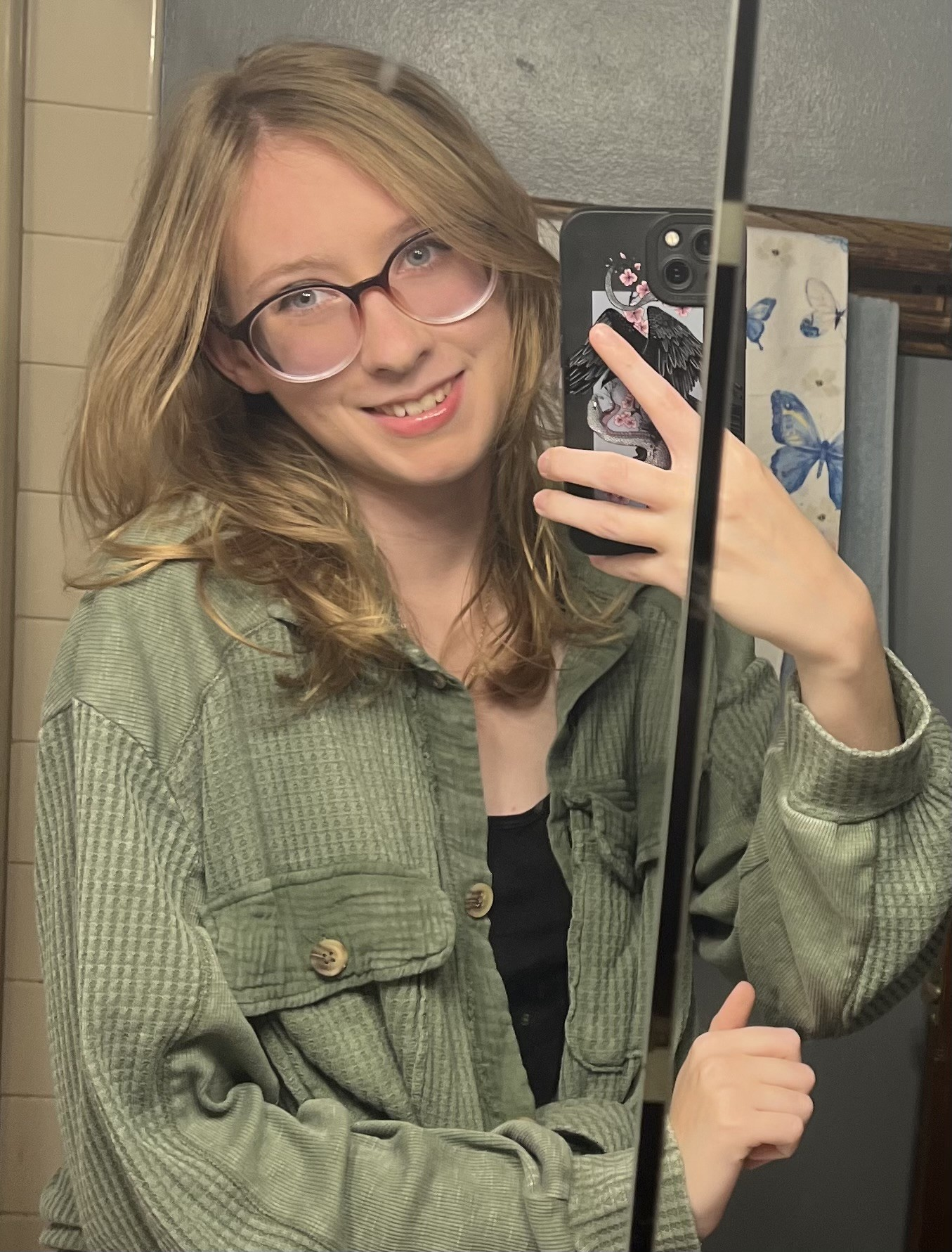 Faith Gallager Young woman selfie with phone mirror
