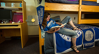 student on EIU blanket in residence hall