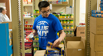 student in food pantry